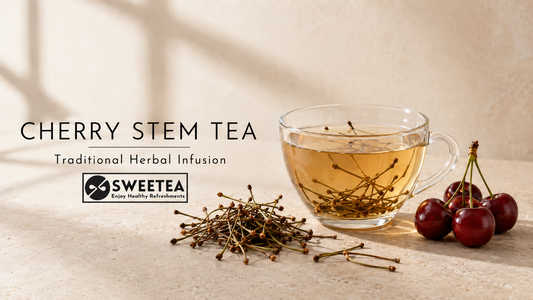 Cherry stem tea with dried cherry stalks, fresh red cherries and a glass cup of caffeine-free herbal infusion by Sweetea.