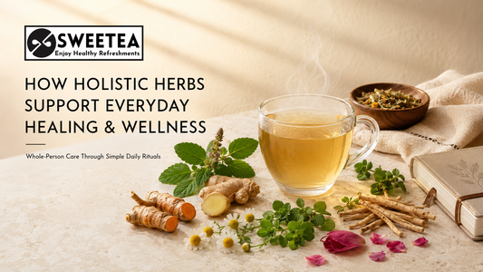 A selection of traditional herbs beside a warm cup of Sweetea herbal tea, representing holistic wellness, mindful self-care and evidence-aware daily herbal living.